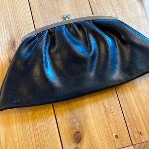 Classic beautiful black leather and lined vintage clutch